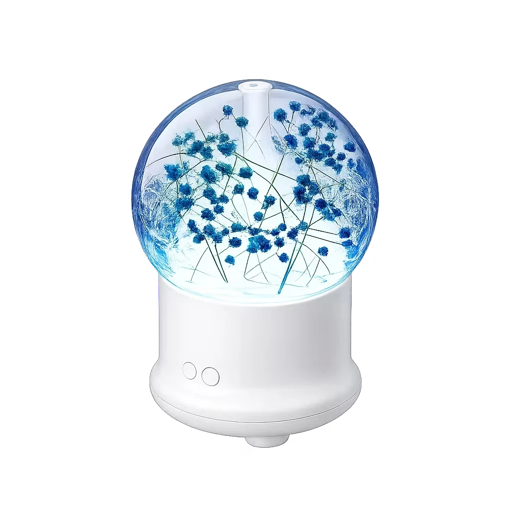 Roselle Wellness flower aromatherapy diffuser with a clear glass dome containing blue dried flowers on a white base.